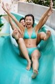 Couple going down water slide - Jade Lee