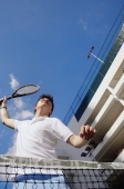 Man playing tennis, low angle view - Alex Microstock02