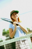 Woman holding tennis racket, looking away - Alex Microstock02