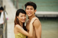Couple looking at camera, jetty in the background - Jade Lee