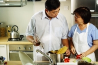 Couple cooking in kitchen - Jade Lee