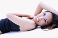 Woman in black tube top, lying on back, looking at camera - Alex Microstock02