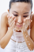Woman splashing face with water - Alex Microstock02