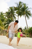  Father and daughter holding hands on beach, walking - Alex Microstock02