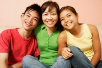 Mother with son and daughter, looking at camera, smiling - Alex Microstock02