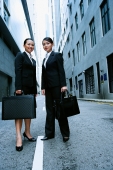 Business women standing side by side looking at camera, portrait - Alex Microstock02