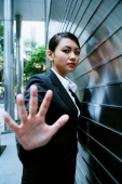 Business women hand outstretched, looking at camera - Alex Microstock02