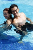  Couple in swimming pool, looking at camera - Alex Microstock02