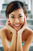 Young woman, smiling at camera, hands on face - Alex Microstock02