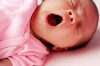 Baby lying down, yawning, eyes closed - Alex Microstock02