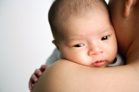 Mother carrying infant, over the shoulder view - Alex Microstock02