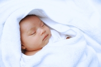 Baby wrapped in blanket, sleeping - Alex Microstock02