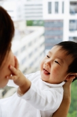 Baby boy touching mother's face - Alex Microstock02