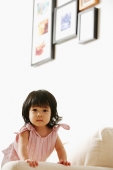 Baby girl on sofa, looking at camera - Alex Microstock02