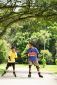 Father and son in park, on roller blades - Alex Microstock02
