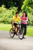 Son on bicycle, mother next to him - Alex Microstock02