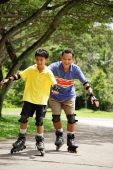 Father and son in park, on roller blades - Alex Microstock02