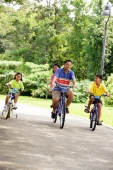 Family with two children, cycling side by side - Alex Microstock02