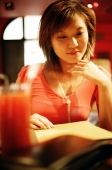 Young woman looking at menu - Alex Microstock02