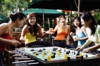 Group of young women playing foosball - Alex Microstock02