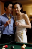 Couple standing side by side, holding champagne glasses - Alex Microstock02