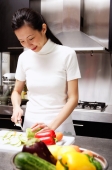 Woman cutting vegetables, smiling - Alex Microstock02
