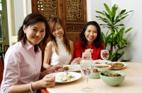 Three women having a meal at restaurant - Alex Microstock02