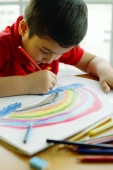 Boy holding colour pencil, drawing a rainbow - Alex Microstock02