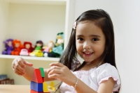 Young girl playing with building blocks - Alex Microstock02