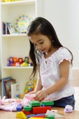 Young girl playing with toys - Alex Microstock02