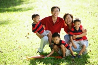 Family with three boys on field, portrait - Alex Microstock02