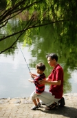 Father teaching son to fish - Alex Microstock02