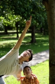 Father and son in park, father pointing up - Alex Microstock02