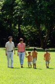 Family with three boys in park, walking - Alex Microstock02