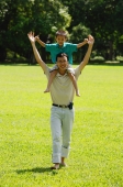 Father carrying son on shoulders - Alex Microstock02