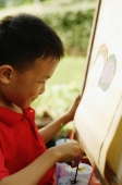 Boy painting on easel, portrait - Alex Microstock02