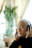 Man with headphones, listening to music, eyes closed - Alex Microstock02