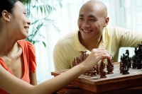 Couple at home, playing chess - Alex Microstock02