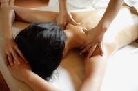 Woman lying on front having body massage - Alex Mares-Manton