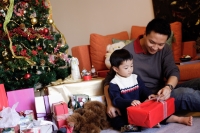 Father and son opening gifts on Christmas - Alex Microstock02