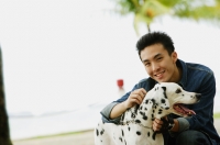 Man with Dalmatian dog, smiling at camera - Alex Microstock02