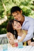 Couple embracing, both smiling at camera, portrait - Wang Leng