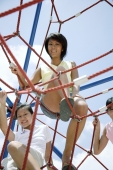 Young women climbing ropes at playground - Alex Microstock02