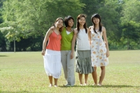Young women standing side by side in park - Wang Leng
