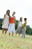 Young women standing side by side, smiling at camera - Wang Leng