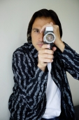 Man holding video camera - Yukmin