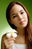 Young woman holding Frangipani flower - Alex Microstock02