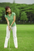 Woman playing golf - Alex Mares-Manton