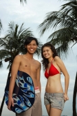 Couple in beach wear, looking at camera - Yukmin
