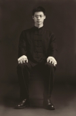 Man sitting for studio portrait - Alex Mares-Manton